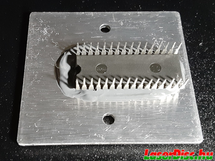 The IC attached to the heatsink from the MUSE decoder board.